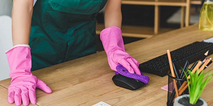 person with gloves cleaning